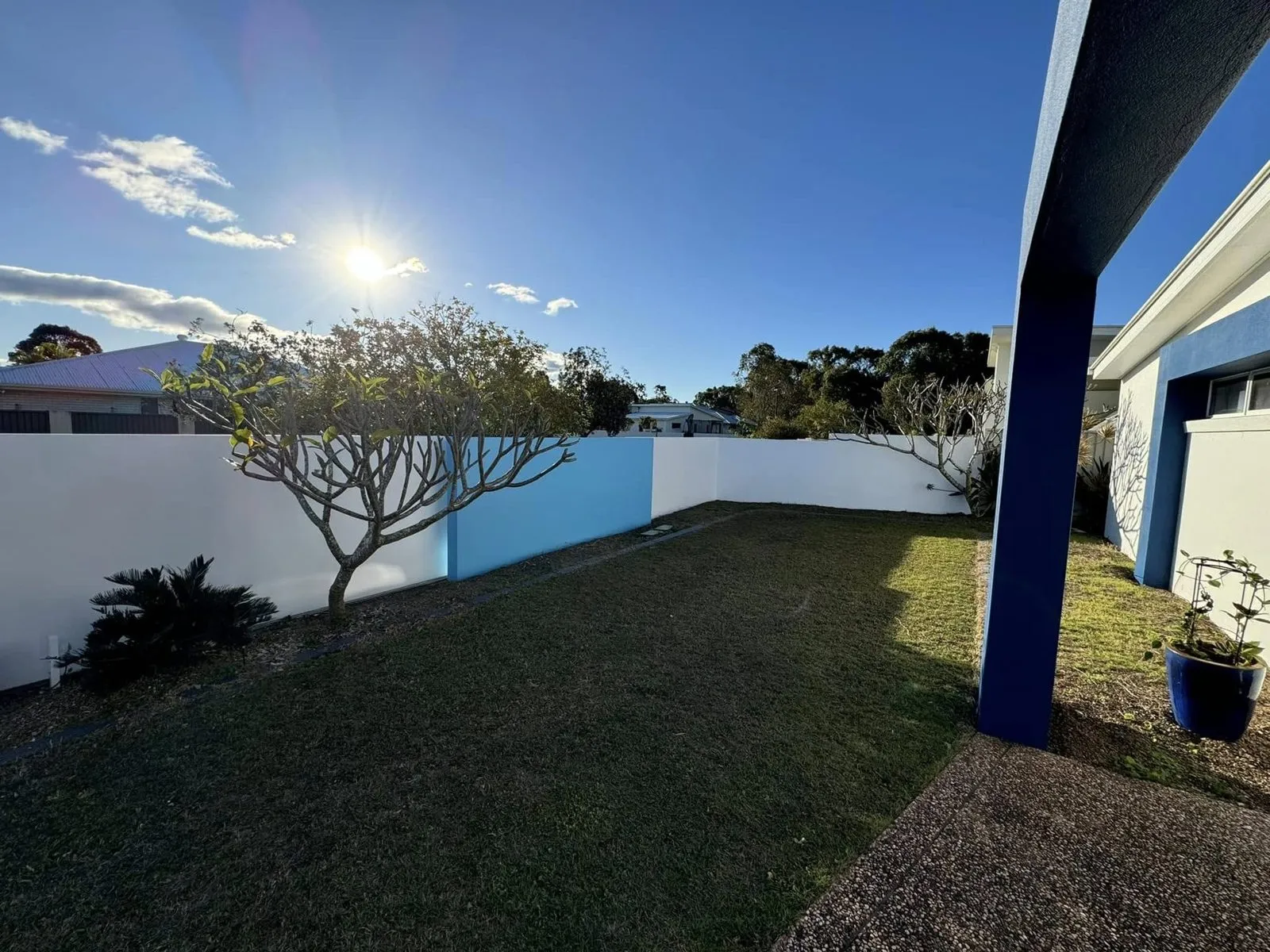 Rendered exterior and blue fence, photo 1