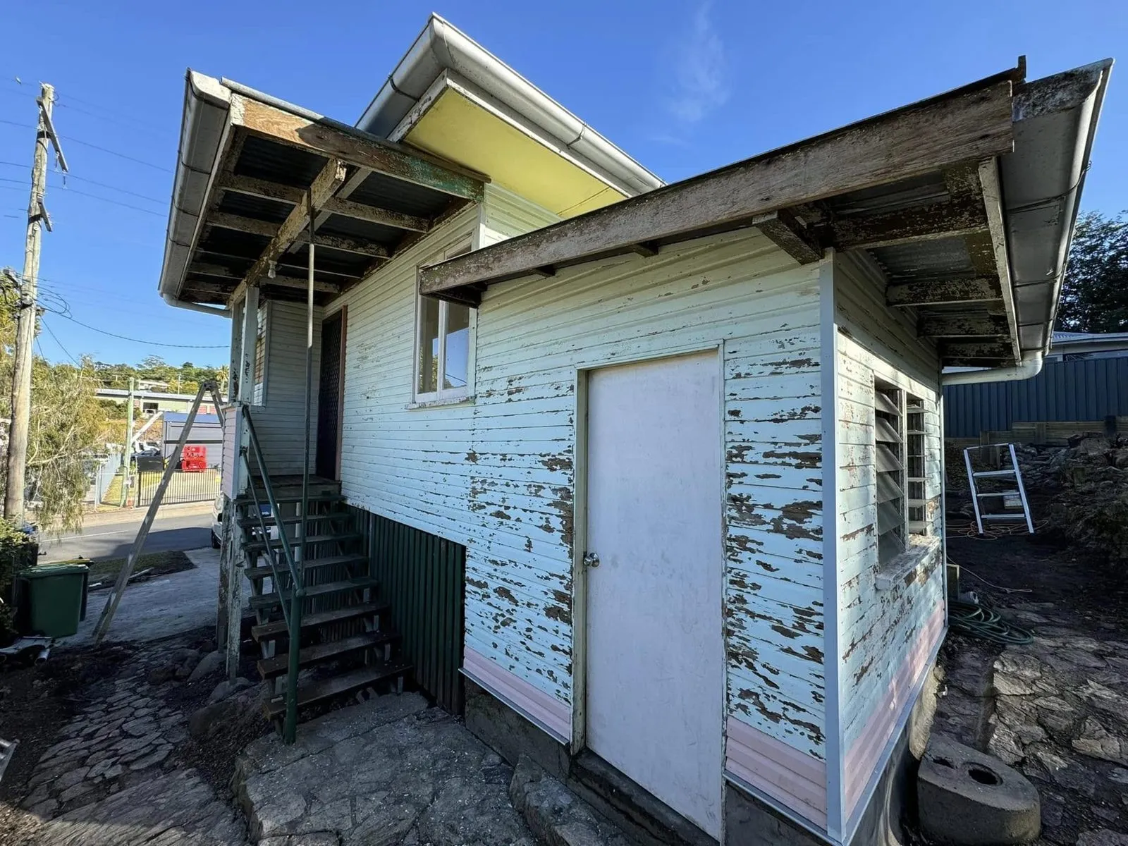 Before: Weatherboard house exterior