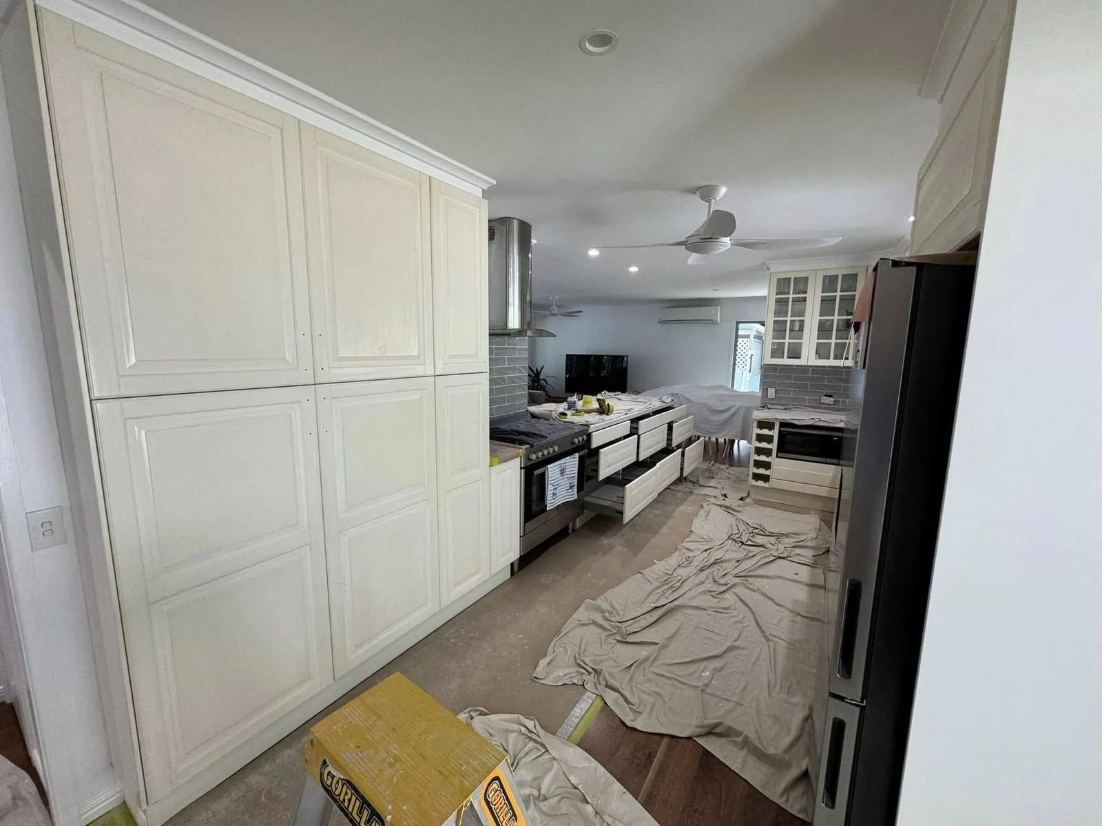 Before: Kitchen cabinets repainted white
