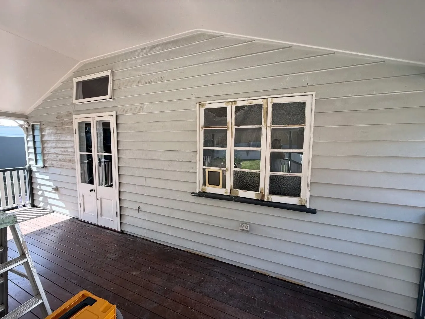 Before: Verandah deck and weatherboard walls